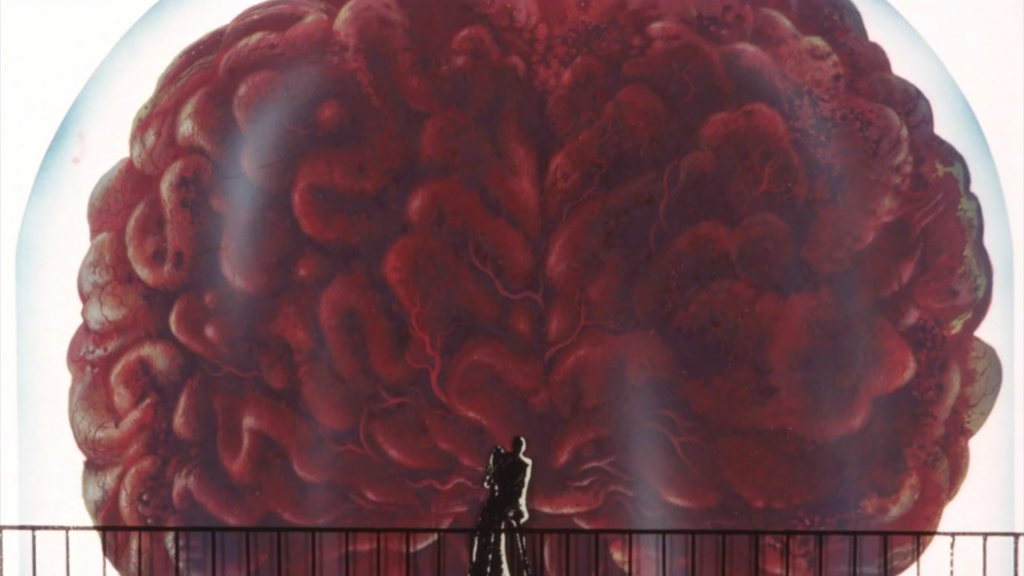 Lupin III faces a giant brain about to take off into space.