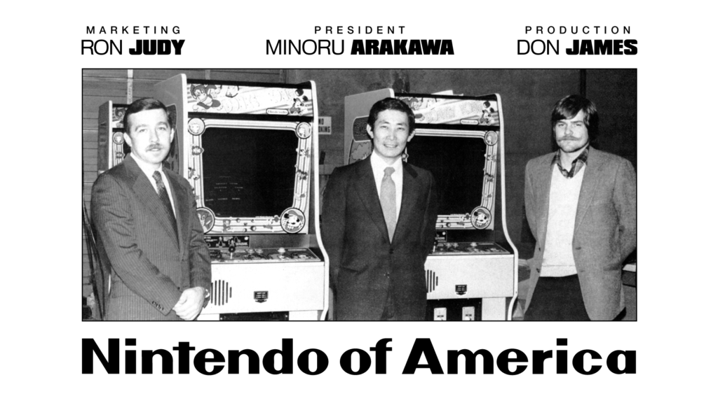 Nintendo Of America posing with Donkey Kong units in their Seattle warehouse.
